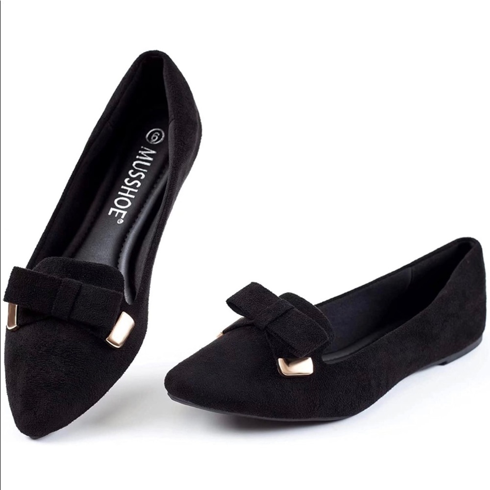 Black ballet flats with bows and gold tips